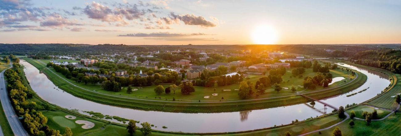 Drone view over Athens as the sun peaks the horizon. 