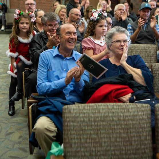 large group of people clapping